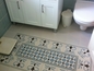 שטיח מרוצף במקלחת